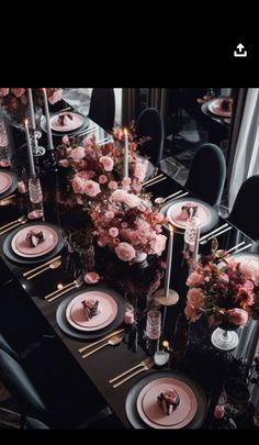 a long table is set with pink flowers and black chairs for an elegant dinner party