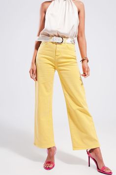 Sunshine yellow mom jeans are the perfect way to bring cheer to the season. These jeans boast of straight legs, a high waist, and a super stretchy fabric. The lining in the pockets is in a lighter color than the external fabric. The pockets are utility and rounded in the front. There are utility pockets in the back as well as functional belt loops. We style the jeans with our Satin Knot Front Top in Beige, in our photos.  The fabric is made from 94% Cotton, 5% Polyester, and 1% Elastane.  The mo Yellow Jeans Outfit, Outfits Con Camisa, Knot Front Top, Mens Lightweight Jacket, Yellow Jeans, Types Of Jeans, Dressy Sandals, Jean Large, Timeless Wardrobe Staples