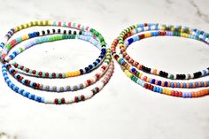 Introducing a beautiful set of random seed bead bracelets, meticulously handmade with love. Inspired by the 'bestseller' summer seed bead bracelets, these bracelets feature tiny beads measuring just 2mm. Perfect for any occasion, these delicate bracelets make a wonderful gift. Embrace the joy of layering bracelets without the heavy or bulky feeling - you'll hardly even notice you're wearing them! The average woman's wrist size is around 7 in When orders are prepared I choose completely random br Everyday Round Beaded Bracelets With 108 Beads, Summer Friendship Bracelets With Spacer Beads, Adjustable Minimalist Multicolor Beads, Minimalist Beaded Bracelets With Tiny Beads For Summer, Minimalist Round Bead Bracelets For Summer, Minimalist Summer Bracelets With Round Beads, Minimalist Multicolor Round Bead Friendship Bracelets, Minimalist Multicolor Beaded Friendship Bracelets, Minimalist Beaded Bracelets With Spacer Beads For Beach