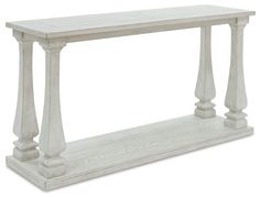 a white wooden table with pillars on top