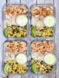 four plastic containers filled with rice, shrimp and veggies on top of a wooden table