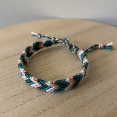 A handmade bracelet or anklet woven with shades of white, green, and orange colors. A friendship or statement bracelet perfect for this summer! Made with high quality embroidery thread. Approx. 9 inches/ 30 centimeters long. Made in a smoke free, pet free home. Orange Bohemian Braided Bracelets For Friendship, White Braided Adjustable Beaded Bracelets, White Braided Jewelry For Friendship, Casual White Woven Jewelry, White Braided Beaded Bracelets As Gift, Multicolor Handwoven Casual Friendship Bracelets, Casual Orange Friendship Bracelets For Festivals, Casual Handwoven Braided Bracelets For Beach, Casual Handwoven Multicolor Friendship Bracelets