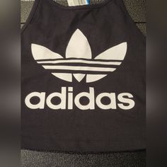 Adidas Trifoil Tank Size M Nwt. Approximate Measurements Are Shown In Photos. C14 Black Logo Print Tank Top For Streetwear, Black Logo Tops For Spring, Black Fitted Tops With Logo, Casual Adidas Logo Top For Workout, Casual Adidas Workout Top, Casual Workout Top With Adidas Logo, Black Cotton Tank Top With Logo Print, Trendy Black Tops With Logo, Adidas Logo Summer Top