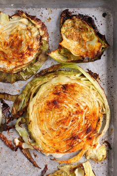 grilled artichokes on a baking sheet