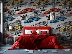 a bed room with a neatly made bed and a wallpaper that has racing cars on it