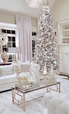 a white christmas tree in a living room