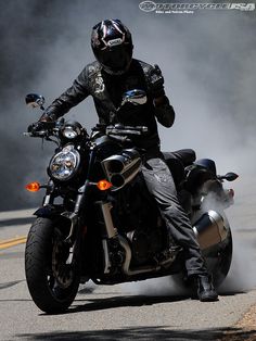 a man riding on the back of a motorcycle