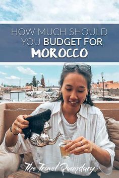 a woman sitting on a couch holding a bird in her hand and the words how much should you budget for morocco?