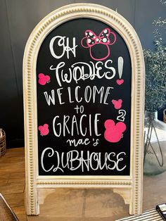 a chalkboard sign with minnie mouses on it