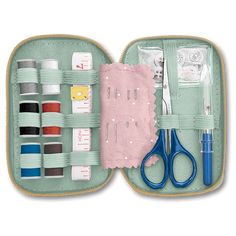 an open case with scissors, thread and sewing supplies