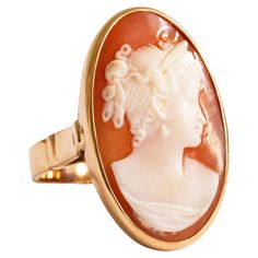 A vintage 14 K Yellow Gold ring with Cameo in an oval setting. The cameo features a female silhouette in the Victorian style. The ring is stamped with K14 that stands for the 14 karat gold content. The item was manufactured in the middle of the 20th century and it is in good vintage condition. The ring size is 6.5. The Cameo ring is one of the most classic example of jewelry that is indispensable in each woman's collection. Female Silhouette, Oval Setting, Cameo Ring, Carved Shell, Woman Silhouette, Yellow Gold Ring, Victorian Style, Victorian Fashion, Yellow Gold Rings