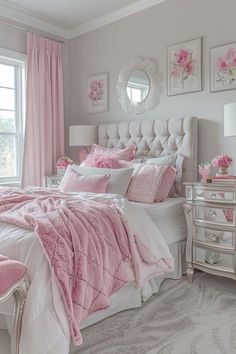 a bedroom decorated in pink and white