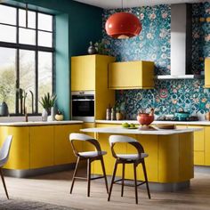 Modern kitchen with yellow cabinets, floral backsplash, and a central island with bar stools. Colorful Backsplash Ideas, Funky Interior, Colourful Kitchens, Funky Interior Design, American Style Kitchen