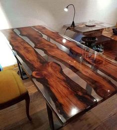 a wooden table sitting in the middle of a room