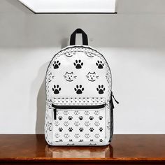 Show off your love for cats with this Cat Paw Black and White Backpack! Designed for cat lovers, this stylish and functional bag features a chic black-and-white design with adorable cat paw prints. Perfect for school, work, travel, or everyday use, this backpack combines practicality with a touch of feline charm. Spacious & Functional: Multiple compartments, including a main storage area and side pockets, to organize your essentials like books, gadgets, and more. Durable & Comfortable: Made with Paw Cat, Functional Backpack, Backpack Gift, Everyday Backpack, Paw Design, Sewing Tags, Cat Paw, Gift For Girls, Cat Paws