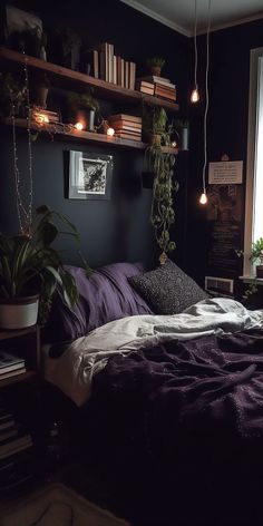 a bed with purple sheets and pillows in a dark room next to a large window