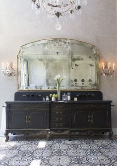 a large mirror sitting above a wooden dresser