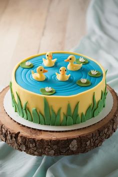 there is a cake decorated with ducks in the water