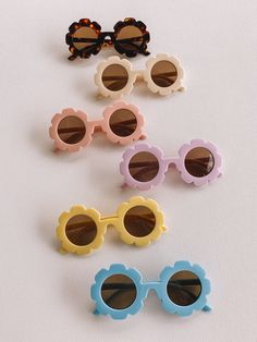 flower sunnies one size fits most 1Y-5Y (could fit older or younger child depending on head size!) UV400 lenses plastic frame + lens Playful Flower-shaped Plastic Sunglasses, Cute Flower Shaped Sunglasses With Uv Protection, Cute Blue Summer Sunglasses, Cute Blue Sunglasses For Summer, Playful Sunglasses For Summer Playtime, Playful Blue Sunglasses For Spring, Fun Blue Sunglasses For The Beach, Playful Blue Sunglasses With Uv Protection, Fun Blue Sunglasses For Vacation