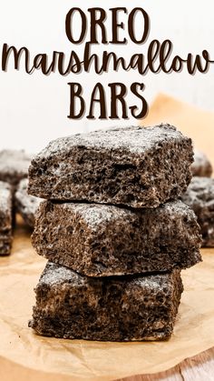 chocolate oreo marshmallow bars stacked on top of each other with text overlay