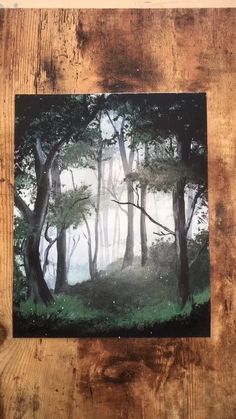 an image of a painting on wood with trees