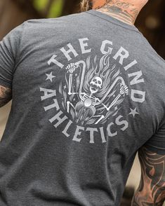 The Grind Athletics Freedom Rider Sports Cotton T-shirt With Back Print, Sports T-shirt With Back Print And Crew Neck, Cotton Gym Tops With Back Print, Heather Grey Crew Neck Sports T-shirt, Tri-blend Cotton T-shirt For Gym, Graphic Tee Tri-blend T-shirt For Sports Events, Tri-blend Graphic Tee For Sports Events, Cotton Tri-blend T-shirt For Gym, Sporty Tri-blend Pre-shrunk T-shirt