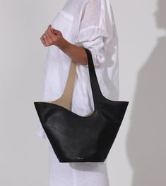 Astrid Tote Bag | Black & Moccasin Totes Cleobella Modern Sculptural Leather Bags, Modern Bucket Bag With Leather Lining, Architectural Structure, Black Moccasins, Trending Handbags, Fall Handbags, Zodiac Bracelet, Shop Bags, Crochet Cover Up