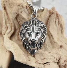 Stainless steel necklace with the king of beasts! The 4mm box chain and solid lion head pendant are made from durable stainless steel. A real "eye-catcher"! Jewelery made of stainless steel is very robust, rust-free and nickel-free and therefore skin-friendly. This means that it usually does not trigger any allergic reactions. In addition, it hardly ever tarnishes and does not rub off. Chain length approx. 50 or 60 cm A-57 Chain Necklace Silver, Box Chain Necklace, Lion Head, Steel Necklace, Silver Chain Necklace, Stainless Steel Necklace, Steel Jewelry, Stainless Steel Jewelry, Box Chain