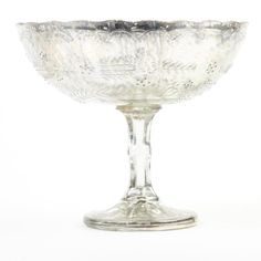 an ornate glass bowl on a white background