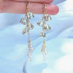 👂PRODUCT DETAILS  Crystal Wind Chime Earrings by ELEVEN11DREAM - Material: High-Quality Swarovski Crystal and 14Kgold Plated - Size: Length 7in.  /width2.95in.     Length 2cm /width0.78cm - Sold in pairs 🎈SHIPPING - All orders will be shipped within 1-3 business days after the order has been received - Ship all orders via USPS First-Class Mail - FREE SHIPPING for all USA domestic orders 💖PLEASE READ THE PRODUCT DESCRIPTION - All products are made by my hand with love and care in my studio - All products are nicely packaged in a protected clear box or bag to avoid damage - Keep your jewelry away from water or any liquid chemicals to avoid discoloration (for example, swimming or bathing) - Safely store your jewelry in a jewelry box or airlock bag 🔴RETURNS, REFUNDS&EXCHANGES If you would Chime Earrings, Crystal Wind Chimes, Wind Bell, Clear Box, Earrings Christmas, Long Dangle Earrings, Wind Chime, Plate Size, First Class