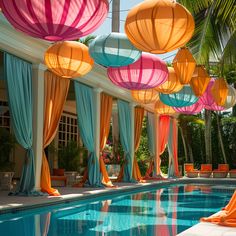 an outdoor pool with colorful lanterns hanging from the ceiling