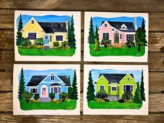 four cards with houses painted on them