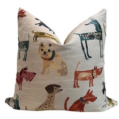 a white pillow with dogs on it