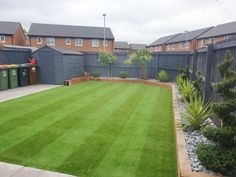 a yard with grass and gravel in the middle