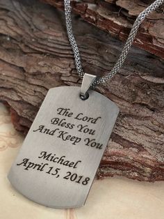 "This personalized Boys First Communion necklace features a high-quality shiny stainless steel dog tag shaped pendant engraved with \"First Holy Communion\", plus young man's name and Communion date. Optional personal message on the back. See photos for examples. The dog tag measures 43mm x 24mm (1.7\" x 1\") and comes on a handsome 17.5\" stainless steel lantern chain. The perfect gift for a special young man on his First Communion day! Comes ready for gift giving in a white cotton-lined gift b Personalized Dog Tag Necklace For Father's Day, Personalized Dog Tag Necklaces For Father's Day, Father's Day Dog Tag Necklace With Engraving Option, Personalized Dog Tag Jewelry For Father's Day, Father's Day Hand Stamped Dog Tag Necklace, Father's Day Hand Stamped Dog Tag Necklaces, Customizable Stainless Steel Necklace For Father's Day, Personalized Dog Tag Necklace With Engraving, Father's Day Laser Engraved Dog Tag Jewelry