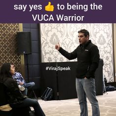 a man standing next to a woman in front of a screen with the caption saying, say yes to being the vcca warrior