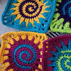 four crocheted squares sitting on top of each other