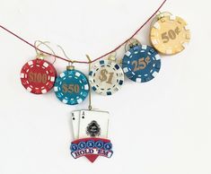 some casino chips are hanging from a string