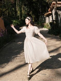 Water your lovely plants in your garden in your Tatiana Cottage Witch Dress from Deer Doll, featuring gathered bust, accented princess waist, puff sleeves, light ethereal fabric. Available in 3 neutral vintage-inspired shades. Size SBust 86cmWaist 66cmLength 105cm Size MBust: 90cmWaist: 70cmLength: 106cm Size LBust: 94cmWaist: 74cmLength: 107cm Ethereal Fabric, Cottage Witch Aesthetic, Witch Cottagecore, Royalcore Aesthetic, Witchy Academia, Aesthetic Fairycore, Deer Doll, Cottage Witch, Witch Dress