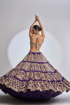 This purple lehenga set features a three-tiered skirt with exaggerated flair and traditional all over gota patti embroidery. The outfit is paired with an embroidered strappy blouse and a matching dupatta.From Seema Gujral’s Samode collectionDELIVERY TIMEPlease wait 8-12 weeks for your outfit to arrive.FABRIC DETAILSGeorgetteProfessional cleaning only. Gota Patti Embroidery, Strappy Blouse, Three Tiered Skirt, Seema Gujral, Purple Lehenga, Black Lehenga, Custom Bridal, Indian Fashion Dresses, Sequins Embroidery