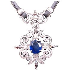 Paul Morelli Garden Gate Sapphire on Leather Necklace in White Gold Sapphire approximately (3.10ctw) and White Diamonds (0.87ctw) 16 inch 16.9 grams total weight. MATCHING EARRINGS SOLD SEPARATELY Paul Morelli has built his career as one of America’s pre-eminent jewelry designers on his reputation of creating modern design with profound attention to detail and delicacy. Each piece is handmade and reflects his quiet dedication to superior craftsmanship and his artistic curiosity. His business is White Gold Sapphire, Garden Gate, Jewelry Designers, Rope Necklace, Garden Gates, Fine Jewellery Necklace, Leather Necklace, Schmuck Design, White Diamonds