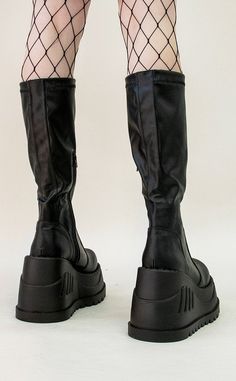 The stompiest boots around! These chonky wedges are a gift from the platform gods, slip in and stomp around babey!!! Vegan Black stretch PU leather 4 3/4 inch platform Perforated designs Knee length boots U.S women's sizing-refer to size chart for more info. Cyberpunk Boots, Cute Platform Shoes, Platform Sneakers Outfit, Platform Shoes Boots, High Platform Boots, Demonia Boots, Knee High Platform Boots, Minimalistic Outfits, Goth Boots