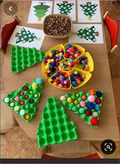 a table topped with lots of different types of christmas tree shaped cookies and candy bars