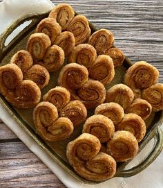 some cinnamon rolls are sitting on a tray