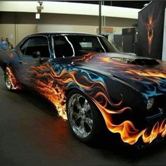 a black car with flames painted on it