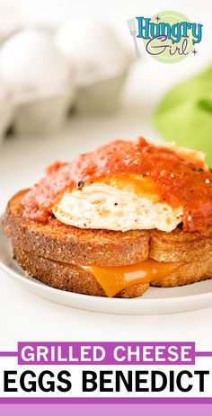 grilled cheese egg sandwich on toasted bread with tomato sauce