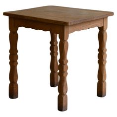 a small wooden table with two legs and a square top on an isolated white background