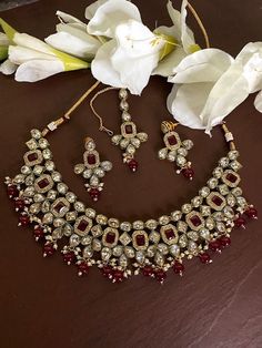 Elegant and delicate  Indian Necklace With  Gold Plating. Indian Bridal Kundan set One Gram Jewelry Choker Set. Very Gorgeous and pretty, Polki choker necklace with matching earrings. Adjustable length with help of dori (cord) Ready to ship from NJ, United States  Gorgeous 24 K gold plated. Red Ruby Necklace With Tilla Details, Handmade Red Kundan Necklace For Party, Handmade Red Kundan Necklaces, Hand Set Red Kundan Necklace For Gift, Red Jewelry Sets For Celebration, Red Choker Bridal Necklace For Celebration, Red Bridal Choker Necklace For Celebration, Kundan Choker Bridal Necklace As Gift, Kundan Choker Bridal Necklace For Gift