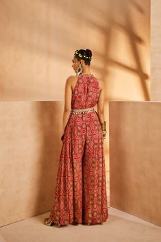 Featuring a bohemian hand-painted print jumpsuit with a hand-embroidered belt accentuated with cowry shells and antique oxidized metallic coins.From Aneesh Agarwaal's Seher collection.DELIVERY TIMEPlease allow 8-12 weeks for your outfit to arrive.FABRIC DETAILSChinonProfessional cleaning only. Indian Outfits Jumpsuit, Indian Wear Jumpsuit, Indian Style Jumpsuit, Bohemian Sleeveless Sets For Festival, Festive Sleeveless Jumpsuits And Rompers, Bohemian Maxi Length Jumpsuits And Rompers For Party, Festive Floor-length Jumpsuits And Rompers For Summer, Bohemian Sleeveless Jumpsuits For Party, Bohemian Sleeveless Jumpsuits And Rompers For Party