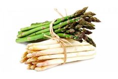 asparagus tied with twine on white background